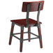 A Lancaster Table & Seating rustic industrial dining side chair with a mahogany finish and metal legs.