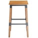 A Lancaster Table & Seating backless wooden bar stool with metal legs.