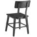 A black Lancaster Table & Seating dining side chair with a wooden backrest and seat.