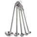 A set of Vollrath stainless steel measuring spoons with handles.