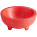 A red Choice Thermal Plastic Molcajete bowl with three legs.