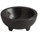 A Choice black thermal plastic Molcajete bowl with a wooden base.