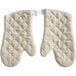 A pair of white Choice terry oven mitts.
