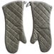 A pair of grey quilted oven mitts.