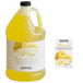 A jug of yellow liquid with a label reading "Narvon Banana Slushy 4.5:1 Concentrate" next to a bottle of lemon oil.