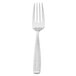 A Walco stainless steel salad fork with a white handle.