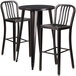 A Flash Furniture 3 piece bar table and chair set with black metal finish. A black metal table with two black metal chairs.