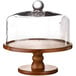 An American Atelier wooden cake stand with a glass dome cover.