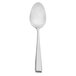 A white spoon with a silver handle.