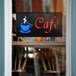 A white rectangular LED cafe sign on a window.