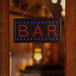 A Choice LED rectangular bar sign hanging on a wooden door with red and blue lights.