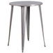 A Flash Furniture round silver metal bar height table with legs.