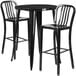 A Flash Furniture black metal bar height table with two black chairs.