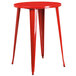 A red metal Flash Furniture bar height table with legs.