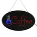 A white oval LED sign that says "Coffee" with a lit up coffee cup and coffee sign.