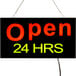 A white LED rectangular sign that says "Open 24 Hours" with black lettering.