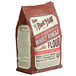 A white bag of Bob's Red Mill whole wheat flour.