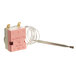 A pink ServIt thermostat with wires attached.