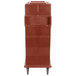 A brick red Cambro Ultra Camcart for food pans.