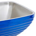 A cobalt blue Vollrath square serving bowl with a stainless steel rim.
