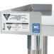 An APW Wyott stainless steel standard duty equipment stand with a label on it.