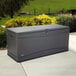 A grey plastic Lifetime outdoor storage box on a patio.