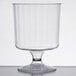 A clear plastic wine cup with a small pedestal base.