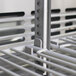 A close-up of a metal rack with a white handle inside a Turbo Air M3 Series undercounter freezer.
