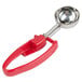 A red and silver Zeroll EZ Squeeze ice cream scoop with a red handle.