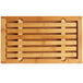 A Cal-Mil bamboo rectangular cutting board with slats over a crumb catcher.