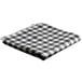 A folded black and white checkered table cover.