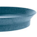 A blue oval deli server with a rim on a table.