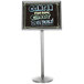 A black Aarco marker board on a chrome pedestal with the words "gellie's" in neon colors.