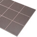A brown Cactus Mat rubber anti-fatigue mat with a honeycomb pattern and holes in it.