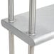 A stainless steel Eagle Group double overshelf with metal legs.