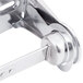 A San Jamar chrome toilet paper holder with a metal lock.