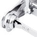 A close-up of a San Jamar chrome metal toilet paper holder with a locking mechanism.