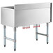 A large stainless steel Regency underbar ice bin with red tubes on legs.