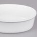 A white oval porcelain serving platter.