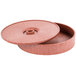 A round pink polyethylene lid with a circular hole on a round polyethylene box.