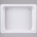 A white melamine food pan with a lid on it.