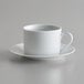 A 10 Strawberry Street bright white porcelain cup and saucer with a white handle.