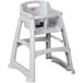 A white plastic Rubbermaid high chair with tray.
