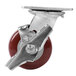 A 4" Swivel Plate Caster with a red and chrome metal wheel.