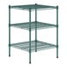 A green metal wire shelf kit with three shelves.