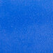 A navy blue surface with small scratches.