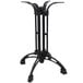A black cast iron Art Marble Furniture table base with four legs.