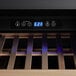 The full glass door of an AvaValley wine cooler with a digital display and blue light.