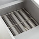 An Anets stainless steel rectangular container with a metal grate inside.