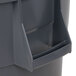 A Continental gray plastic round trash can with a handle and lid.